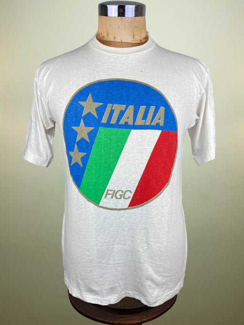 White t-shirt with Italian flag design on a mannequin against a beige background