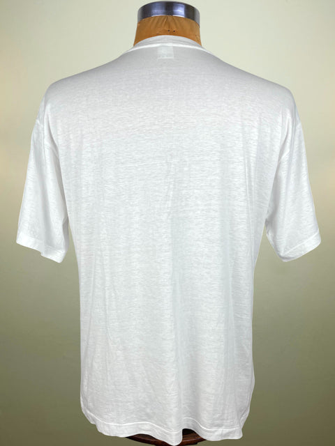 White t-shirt on a mannequin against a plain background