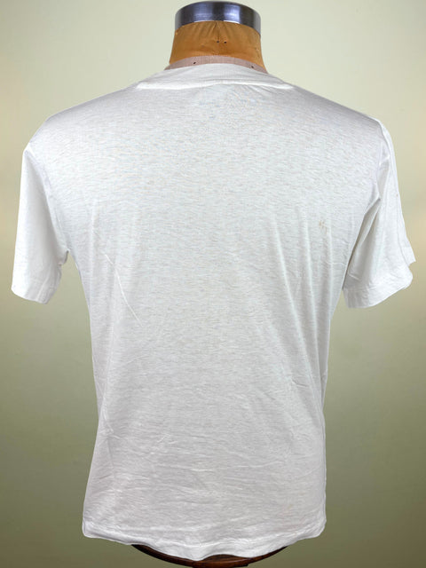 A white short-sleeve crewneck t-shirt displayed on a wooden dress form mannequin, showing the back view against a light beige background.