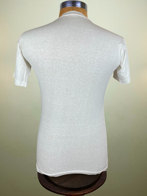 White textured t-shirt on a mannequin against a beige background