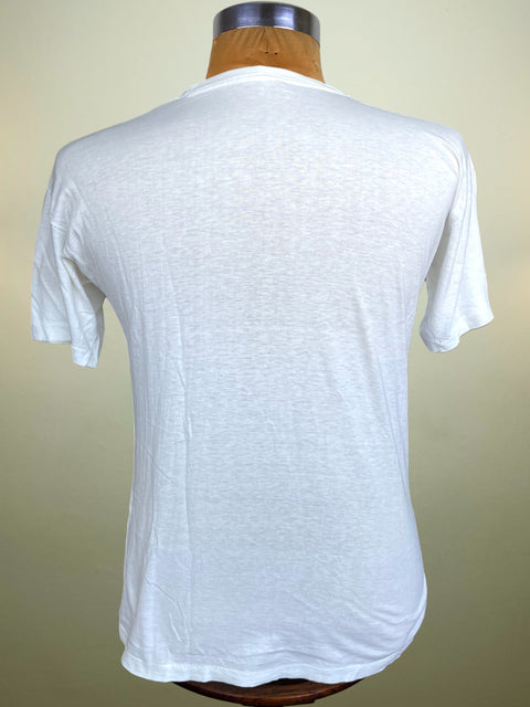 A white short-sleeve crewneck t-shirt displayed on a wooden dress form mannequin, showing the back view against a plain beige background.