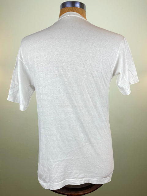 White t-shirt on a mannequin against a plain background