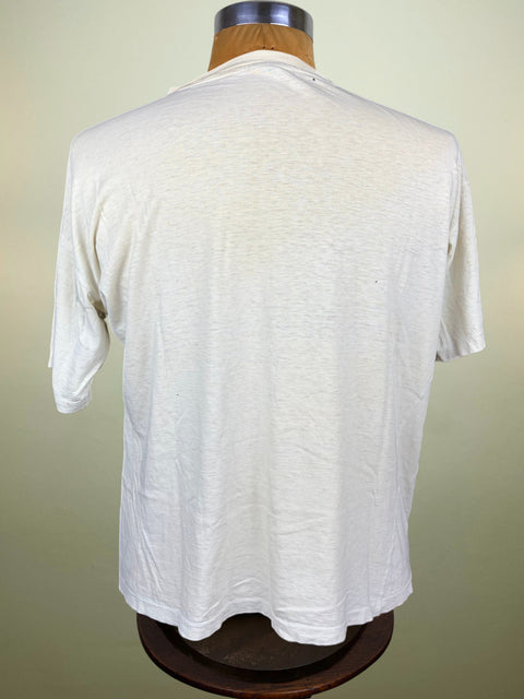 A white short-sleeve t-shirt displayed on a wooden dress form mannequin, viewed from the back against a light beige background.