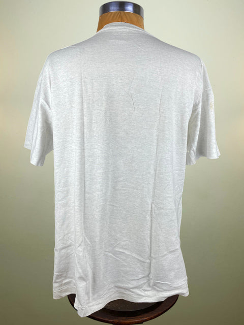 White t-shirt on a mannequin against a beige background