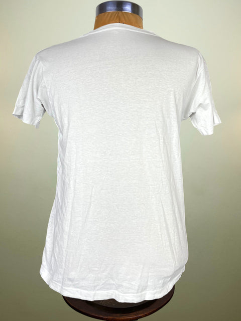 White t-shirt on a mannequin against a beige background