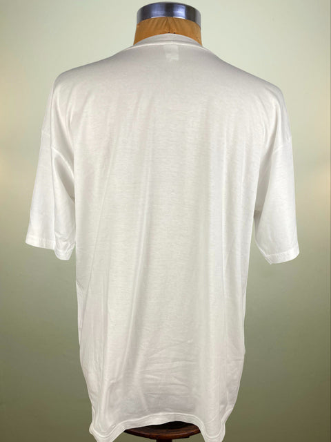 White shirt on a mannequin against a plain background