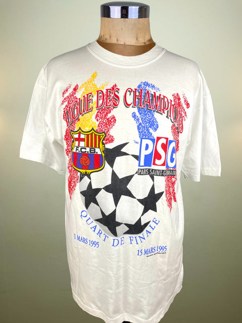 White t-shirt with sports team logos and graphics on a mannequin against a plain background