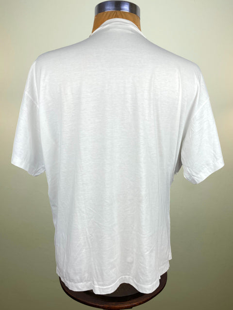 White t-shirt on a mannequin against a plain background