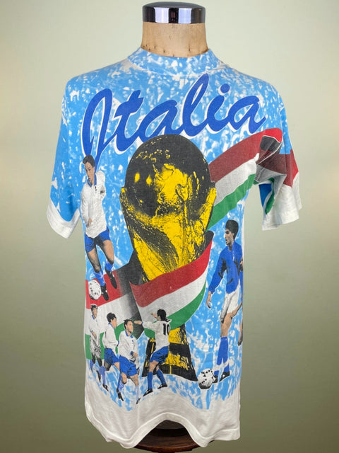 Soccer jersey with 'Italia' and images of players on a mannequin against a beige background
