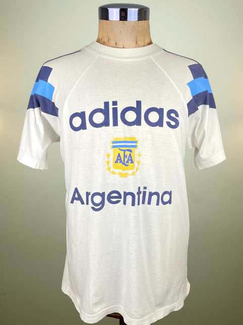 White Argentina T-shirt with Adidas and Argentina logos on a mannequin against a plain background