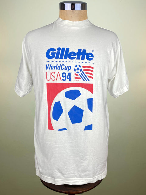 White t-shirt with Gillette World Cup USA 94 graphics on a mannequin against a beige background