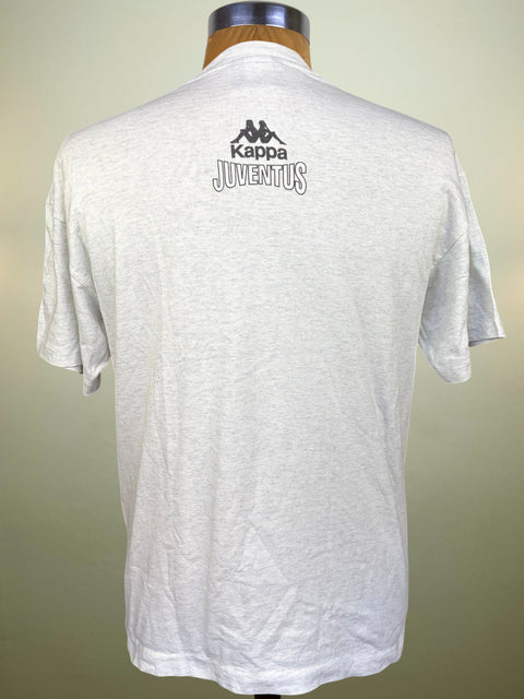 A light gray heather Kappa Juventus short-sleeve t-shirt displayed on a mannequin torso, showing the back with the brand logo and text printed in black.