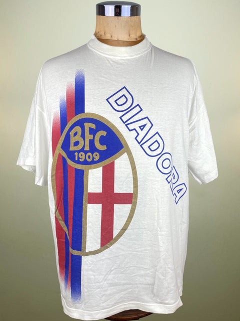 White t-shirt with Diadora and BFC logo on a mannequin against a beige background