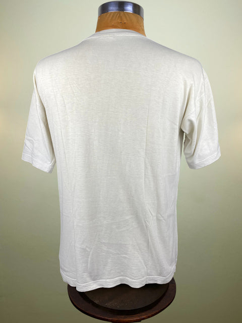White t-shirt on a mannequin against a plain background