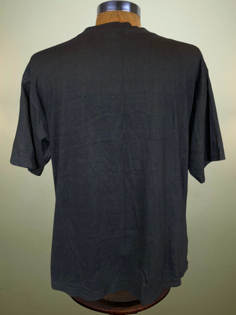 Black t-shirt on a mannequin against a plain background