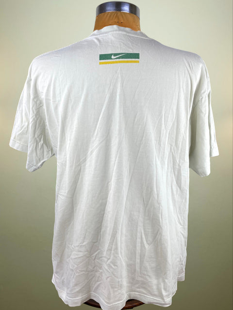 White t-shirt with a Nike logo on the back, displayed on a mannequin against a neutral background.
