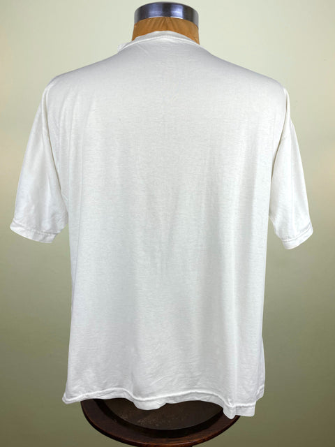 White t-shirt on a mannequin against a plain background