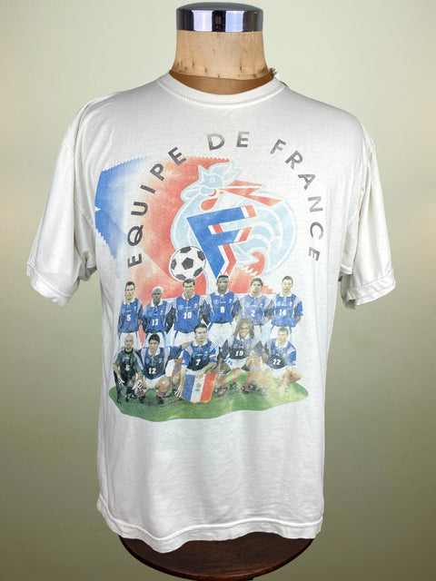 White t-shirt with 'Equipe de France' graphic on a mannequin against a beige background