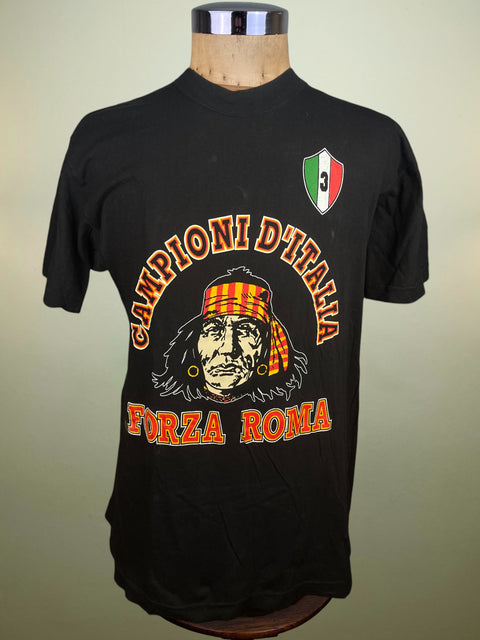 Black t-shirt with graphic design and text on a mannequin against a beige background