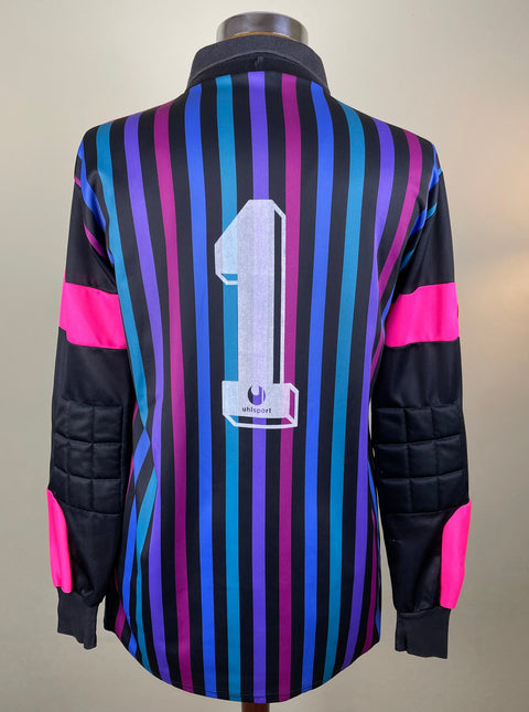 Walter Zenga's match worn long-sleeved Inter Milan 1989-90 jersey featuring a pink base with black and blue vertical stripes. The jersey has a v-neck collarand Zenga's number 1 on the back in light paint.