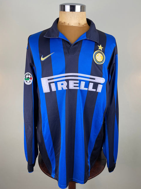 Ronaldo's match worn long-sleeved Inter Milan 1998-99 Soccer jersey with a V-neck, predominantly blue with black accents, and Pirelli sponsor and Nike tick on the chest.