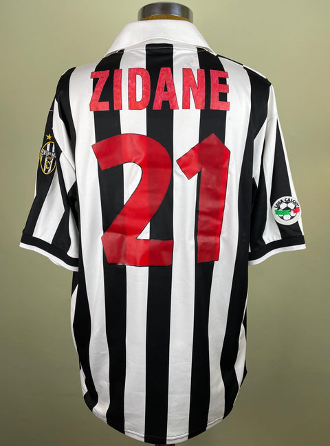 A short-sleeved black and white striped 1998-99 match worn Juventus home jersey with the number 21 and the name ZIDANE on the back in red plastic lettering. 