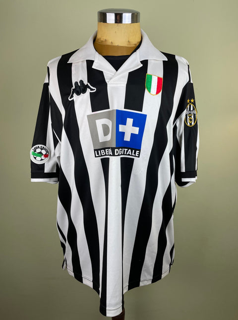 A short-sleeved black and white striped 1998-99 match worn Juventus home jersey with the D+ logo on the chest.