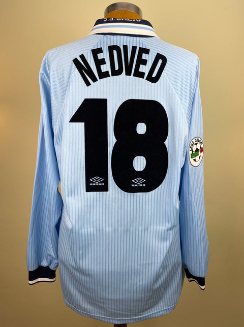 Match worn light blue long sleeve Lazio home shirt from the 1997-98 season worn by Pavel Nedved with name and number 18 in black flock across the back of the shirt. Made by Umbro.