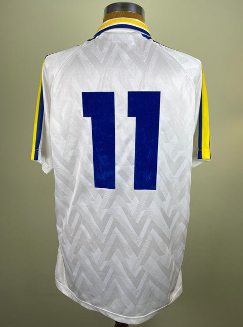 Match worn White Faustino Asprilla short sleeve Parma home shirt from the 1992-93 season, with number 11 in blue flock. Made by Umbro.